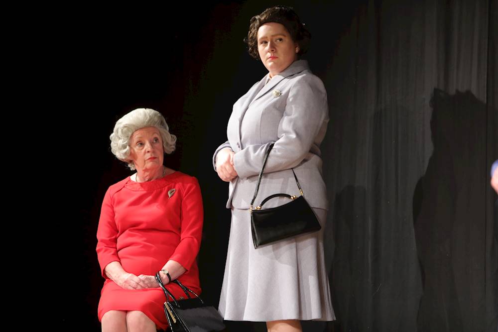 Jane Fosbrook as Q and Sarah Carter as Liz in Handbagged (2019).